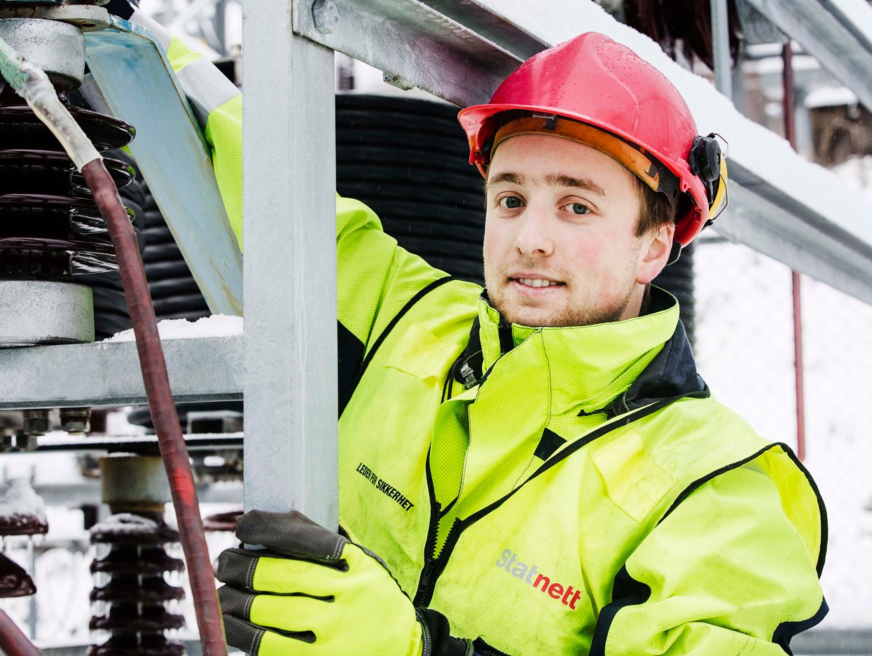 Man working on a substation. Photo.