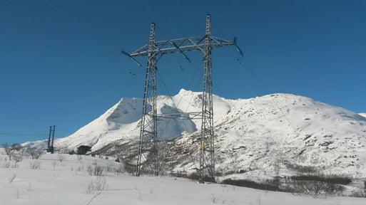 Pylon in snowy landscape