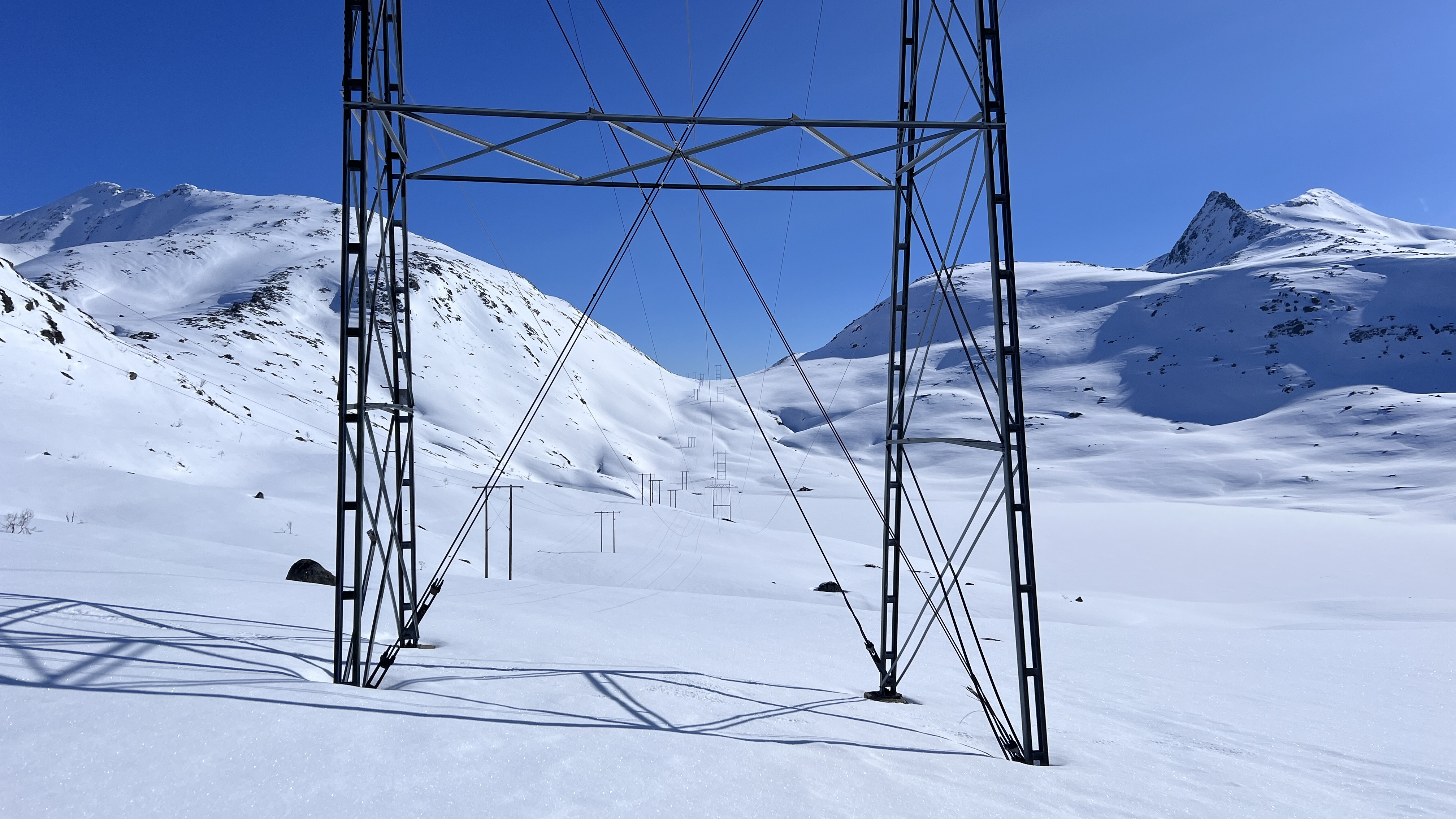 Power lines across a Norwegian mountain landscape.