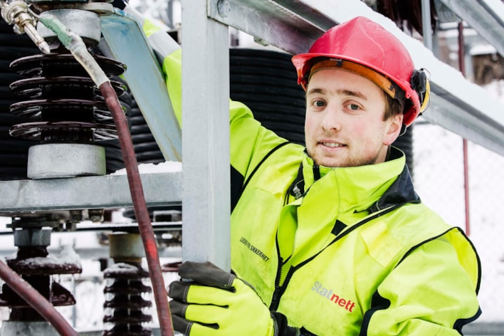 Man working on a substation. Photo.